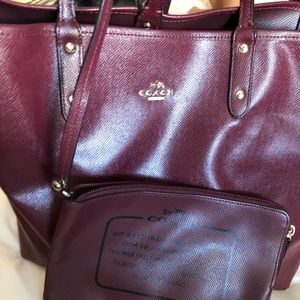 Coach in a beautiful burgundy color